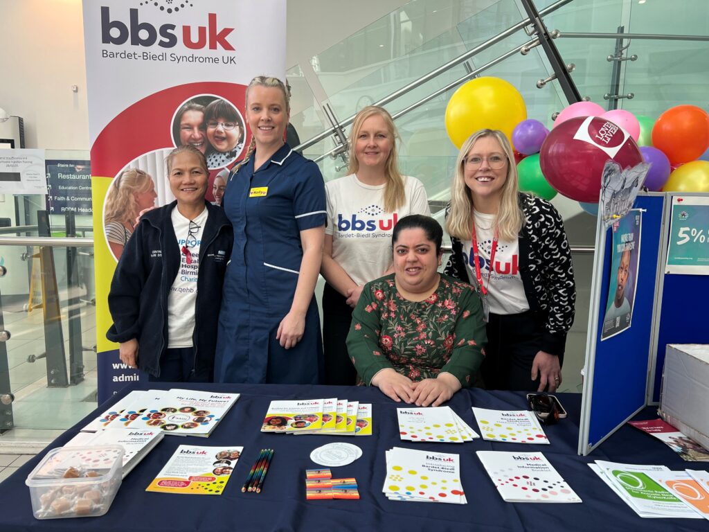 Patient, Aneeba Ahmed, picture with  Patient Liaison Officers, Amy Clapp and Laura Davis, from the Bardet-Biedl syndrome (BBS) UK Clinics Team. Also picture are staff from the Rare Diseases Centre at Queen Elizabeth Hospital Birmingham.