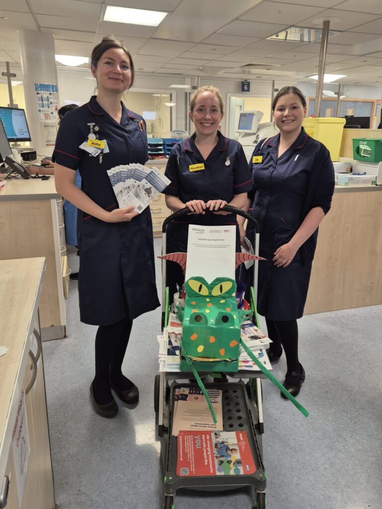 Photograph of research colleagues at the Research Showcase at Good Hope Hospital.